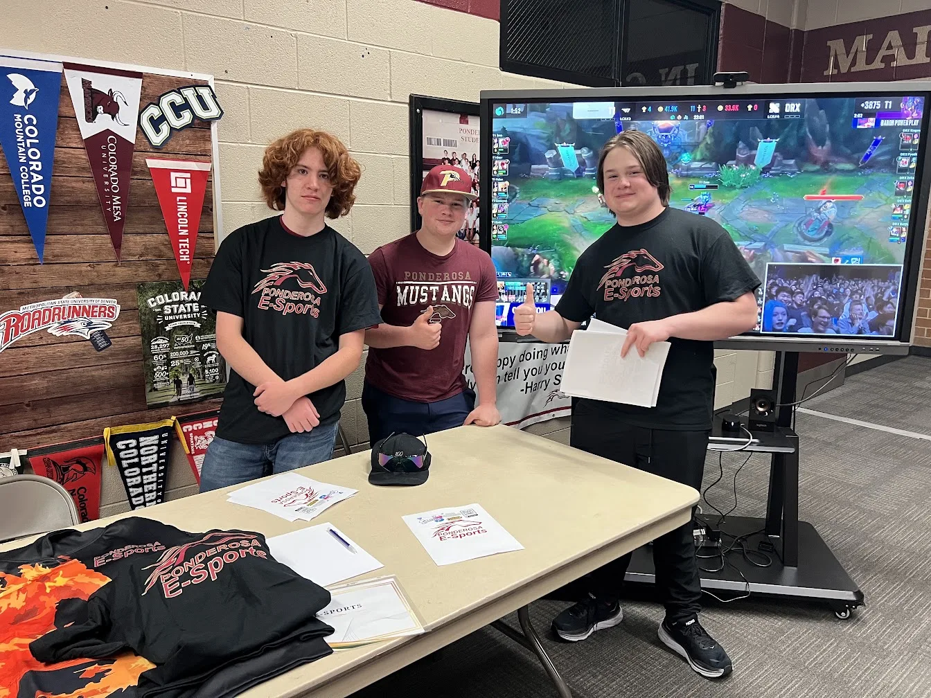 Students representing Ponderosa esports at a school activity table